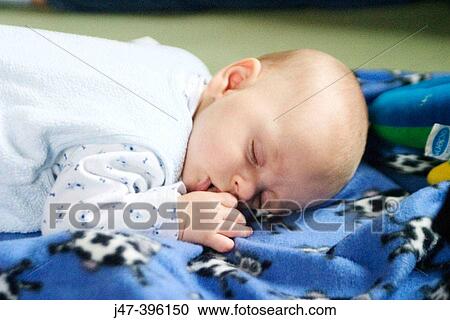 2 month old baby boy, lying on the floor sucking his thumb View Large Photo Image Stock Image - 2 month old baby boy, lying on the floor sucking his thumb. Fotosearch