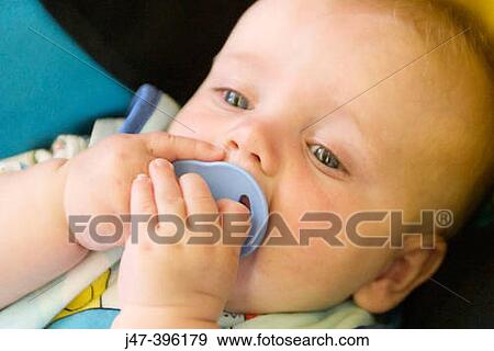 2 month old baby boy, sucking dummy, headshot View Large Photo Image Stock Photo - 2 month old baby boy, sucking dummy, headshot. Fotosearch