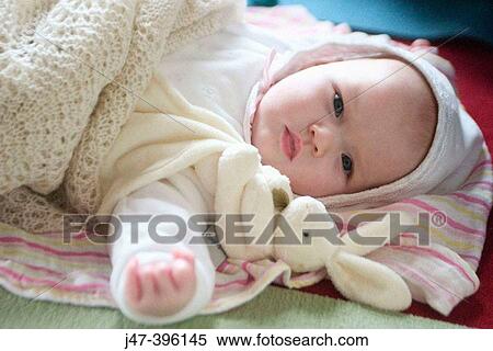 2 month old baby in bonnet, lying on back View Large Photo Image Stock Photography - 2 month old baby in bonnet, lying on back. Fotosearch