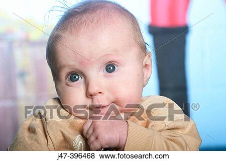 2 month old baby sucking his mouth in and shrugging his shoulders View Large Photo Image Stock Photo - 2 month old baby sucking his mouth in and shrugging his shoulders. Fotosearch