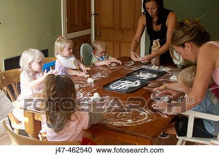 2 mothers doing baking with a group of children View Large Photo Image Stock Image - 2 mothers doing baking with a group of children. Fotosearch