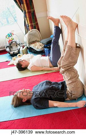 2 mothers in post natal yoga class with their babies View Large Photo Image Stock Photo - 2 mothers in post natal yoga class with their babies. Fotosearch