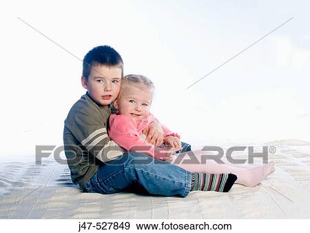 2, three year old children sitting in a row on the floor, studio View Large Photo Image Stock Photo - 2, three year old children sitting in a row on the floor, studio. Fotosearch