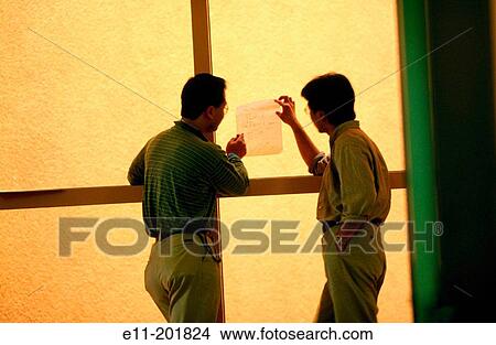 2 workers discuss information in hallway View Large Photo Image Picture - 2 workers discuss information in hallway. Fotosearch