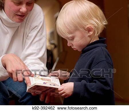 2 year old boy and his mother reading a children's book View Large Photo Image Stock Image - 2 year old boy and his mother reading a children's book. Fotosearch
