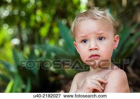 Stock Photo - 2 year old boy at a picnic.. Fotosearch