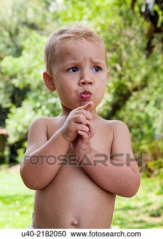 Stock Image - 2 year old boy at Picnic.. Fotosearch