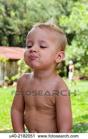 Stock Image - 2 year old boy at Picnic.. Fotosearch