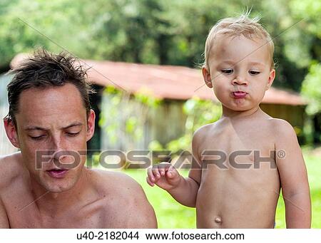 Picture - 2 year old boy in diapers.. Fotosearch