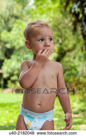 Stock Photo - 2 year old boy in diapers.. Fotosearch