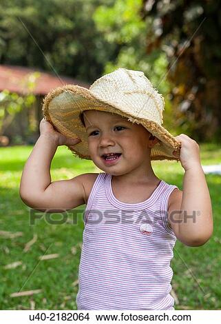 2 year old boy outdoors with cowboy hat. View Large Photo Image Picture - 2 year old boy outdoors with cowboy hat.. Fotosearch