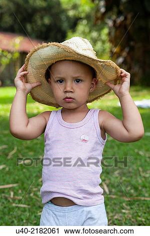 2 year old boy outdoors with cowboy hat. View Large Photo Image Stock Image - 2 year old boy outdoors with cowboy hat.. Fotosearch