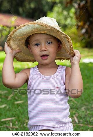 2 year old boy outdoors with cowboy hat. View Large Photo Image Stock Image - 2 year old boy outdoors with cowboy hat.. Fotosearch