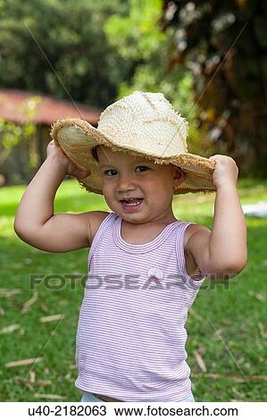 2 year old boy outdoors with cowboy hat. View Large Photo Image Stock Image - 2 year old boy outdoors with cowboy hat.. Fotosearch