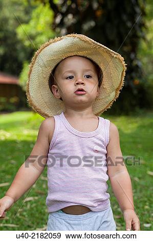 2 year old boy outdoors with cowboy hat. View Large Photo Image Stock Photo - 2 year old boy outdoors with cowboy hat.. Fotosearch