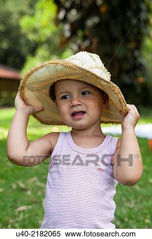 2 year old boy outdoors with cowboy hat. View Large Photo Image Stock Photography - 2 year old boy outdoors with cowboy hat.. Fotosearch