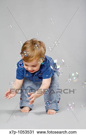 2 year old boy with bubbles View Large Photo Image Stock Image - 2 year old boy with bubbles. Fotosearch
