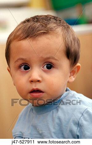 2 year old boyl, looking off camera, at nursery, serious View Large Photo Image Stock Image - 2 year old boyl, looking off camera, at nursery, serious. Fotosearch