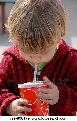 2 year old child who has a beverage timber straw View Large Photo Image Stock Photo - 2 year old child who has a beverage timber straw. Fotosearch