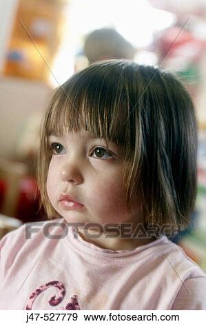 2 year old girl at nursery looking fed up, gazing off camera View Large Photo Image Stock Photo - 2 year old girl at nursery looking fed up, gazing off camera. Fotosearch