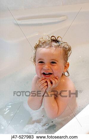 2 year old girl in the bath, laughing hands up to her face View Large Photo Image Stock Image - 2 year old girl in the bath, laughing hands up to her face. Fotosearch