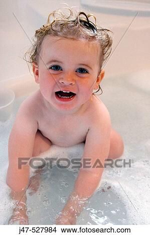 2 year old girl in the bath, smiling into camera View Large Photo Image Picture - 2 year old girl in the bath, smiling into camera. Fotosearch