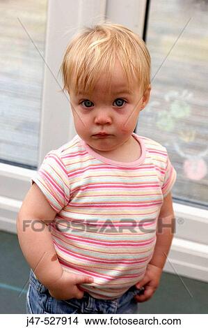 2 year old girl, looking into camera, at nursery, serious View Large Photo Image Picture - 2 year old girl, looking into camera, at nursery, serious. Fotosearch