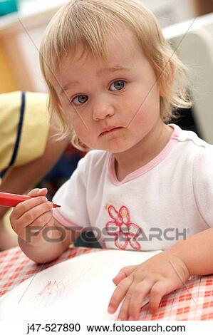 2 year old girl sitting drawing at nursery View Large Photo Image Stock Image - 2 year old girl sitting drawing at nursery. Fotosearch
