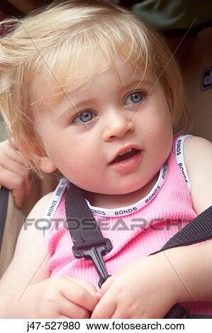 2 year old girl straped into a pram, smiling off camera View Large Photo Image Stock Image - 2 year old girl straped into a pram, smiling off camera. Fotosearch