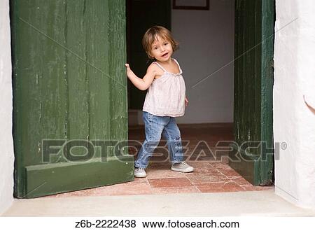 2 years old baby girl at the door, Menorca, Spain. View Large Photo Image Stock Photo - 2 years old baby girl at the door, Menorca, Spain.. Fotosearch