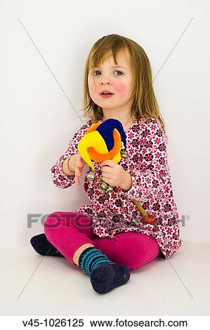 2 years old girl playing with rattle toy. View Large Photo Image Stock Photography - 2 years old girl playing with rattle toy.. Fotosearch