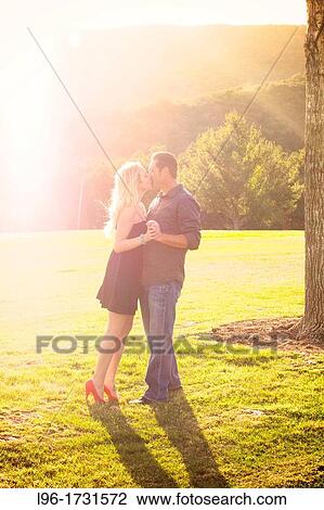 Stock Image - 20-25, engaged couple, caucasian. Fotosearch
