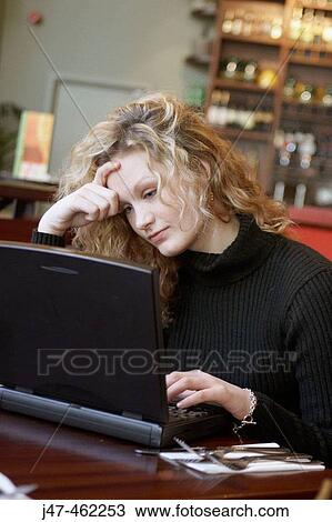 20 year old girl in a bar working on a laptop. View Large Photo Image Stock Image - 20 year old girl in a bar working on a laptop.. Fotosearch