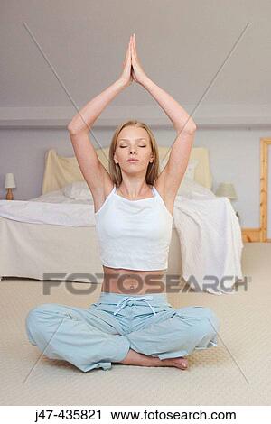 20 year old girl sitting in bedroom, practicing yoga - relaxation View Large Photo Image Stock Image - 20 year old girl sitting in bedroom, practicing yoga - relaxation. Fotosearch