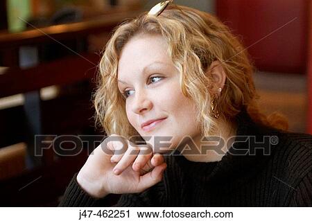 Stock Image - 20 year old girl smiling off camera. Fotosearch