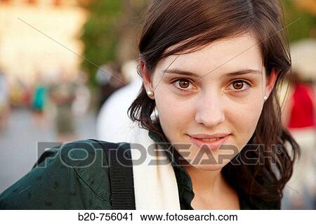 Stock Image - 20 year old woman at Charles Bridge, Prague, Czech Republic. Fotosearch