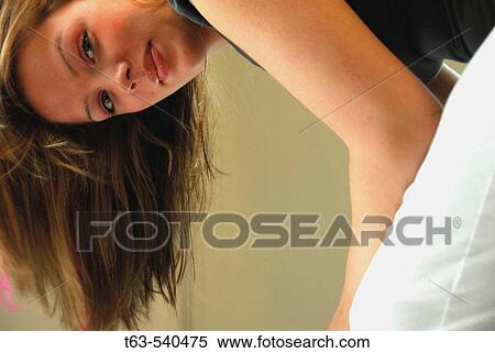 20 yr old woman bent over smiling at the camera View Large Photo Image Stock Photography - 20 yr old woman bent over smiling at the camera. Fotosearch