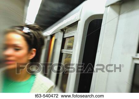 20 yr old woman getting off sky train View Large Photo Image Stock Image - 20 yr old woman getting off sky train. Fotosearch