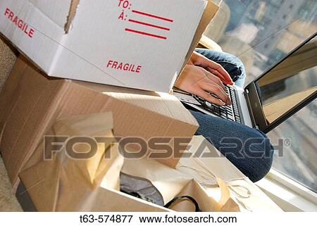 20 yr old woman home shopping on laptop computer View Large Photo Image Stock Photo - 20 yr old woman home shopping on laptop computer. Fotosearch