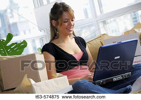 20 yr old woman home shopping on laptop computer View Large Photo Image Stock Photography - 20 yr old woman home shopping on laptop computer. Fotosearch