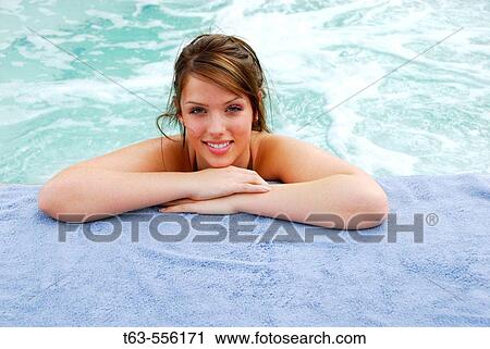 20 yr old woman leaning on arms at edge of hot tub View Large Photo Image Stock Image - 20 yr old woman leaning on arms at edge of hot tub. Fotosearch