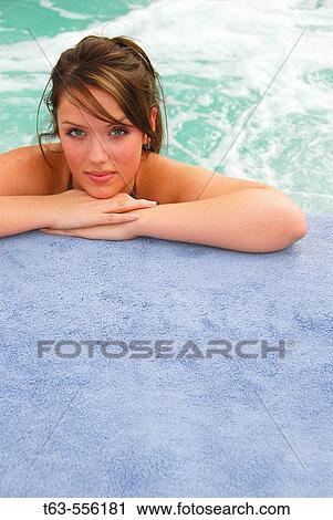 20 yr old woman leaning on hands at edge of spa View Large Photo Image Stock Image - 20 yr old woman leaning on hands at edge of spa. Fotosearch