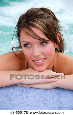20 yr old woman leaning on hands at edge of spa View Large Photo Image Stock Photo - 20 yr old woman leaning on hands at edge of spa. Fotosearch