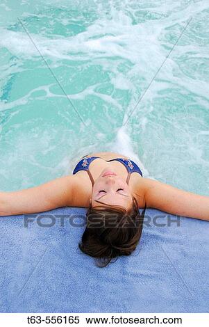 20 yr old woman relaxing in spa View Large Photo Image Stock Photography - 20 yr old woman relaxing in spa. Fotosearch