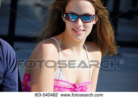 20 yr old woman sitting by the pool with boyfriend View Large Photo Image Stock Image - 20 yr old woman sitting by the pool with boyfriend. Fotosearch