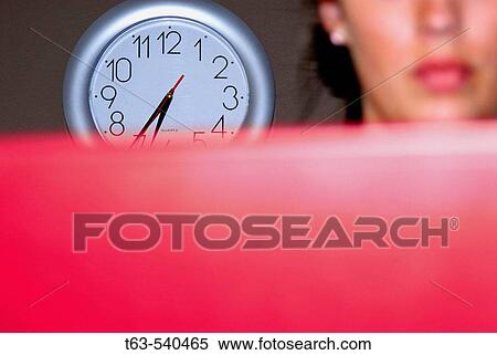 20 yr old woman using laptop computer with clock on wall View Large Photo Image Stock Photography - 20 yr old woman using laptop computer with clock on wall. Fotosearch