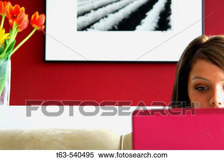 20 yr old woman working on laptop computer at home View Large Photo Image Stock Photography - 20 yr old woman working on laptop computer at home. Fotosearch