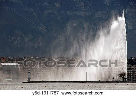 200 meters high famous Jet d? Eau fountain on Geneva Lake, Lac Leman, powered by jet engine, buildings of town of Geneva in the background, Saleve mountain in backgroung behind buildings, Switzerland, Europe View Large Photo Image Stock Photo - 200 meters high famous Jet d? Eau fountain on Geneva Lake, Lac Leman, powered by jet engine, buildings of town of Geneva in the background, Saleve mountain in backgroung behind buildings, Switzerland, Europe. Fotosearch