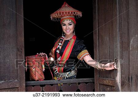 Stock Image - 2014 Miss World Harvest at Sarawak Cultural Village wearing traditional native costumes.. Fotosearch