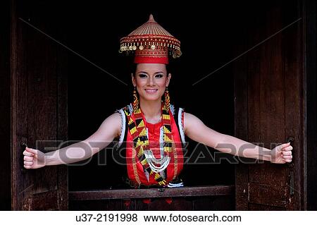 Stock Photo - 2014 Miss World Harvest at Sarawak Cultural Village wearing traditional native costumes.. Fotosearch